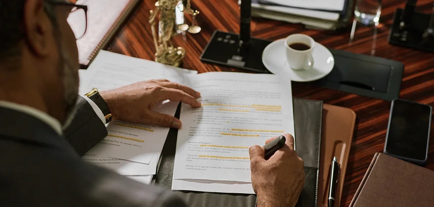 Reviewing legal paperwork at a desk