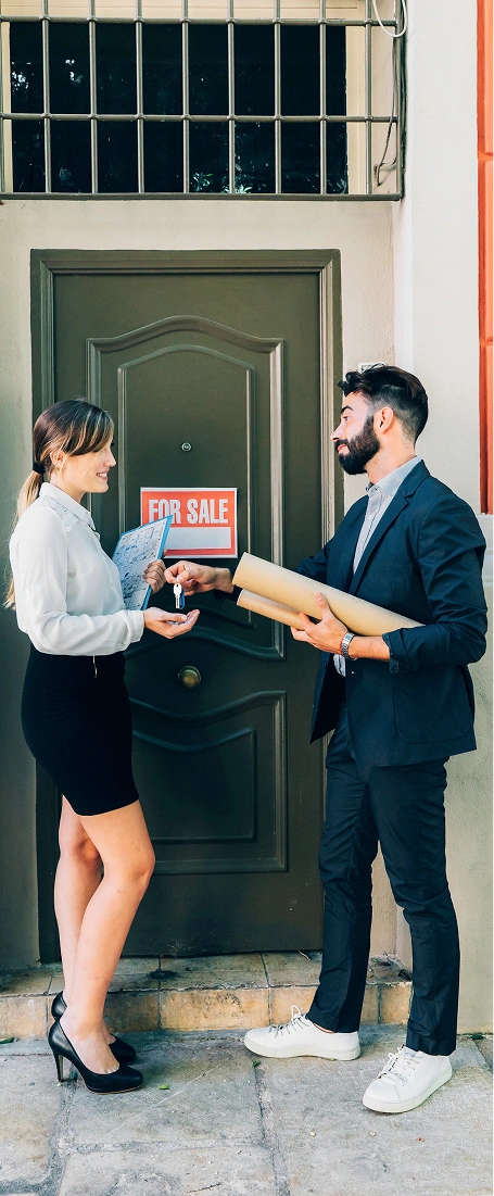 Landlord handing keys to a tenant